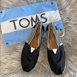 TOMS Slip ons. Women’s size 7. Black and tan